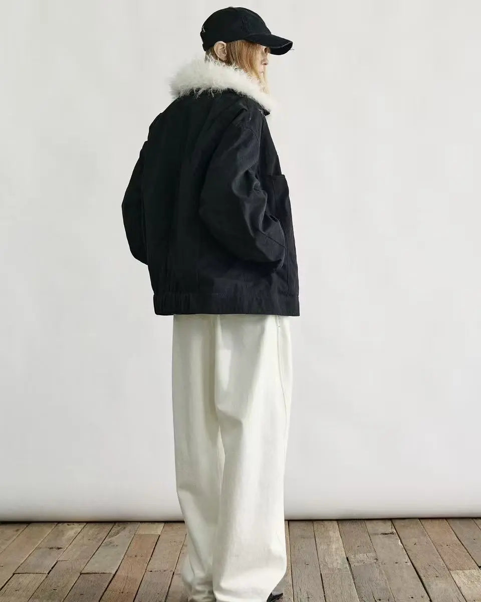 Full-length view of a navy blue down parka with a fur-trimmed hood and multiple utility pockets.