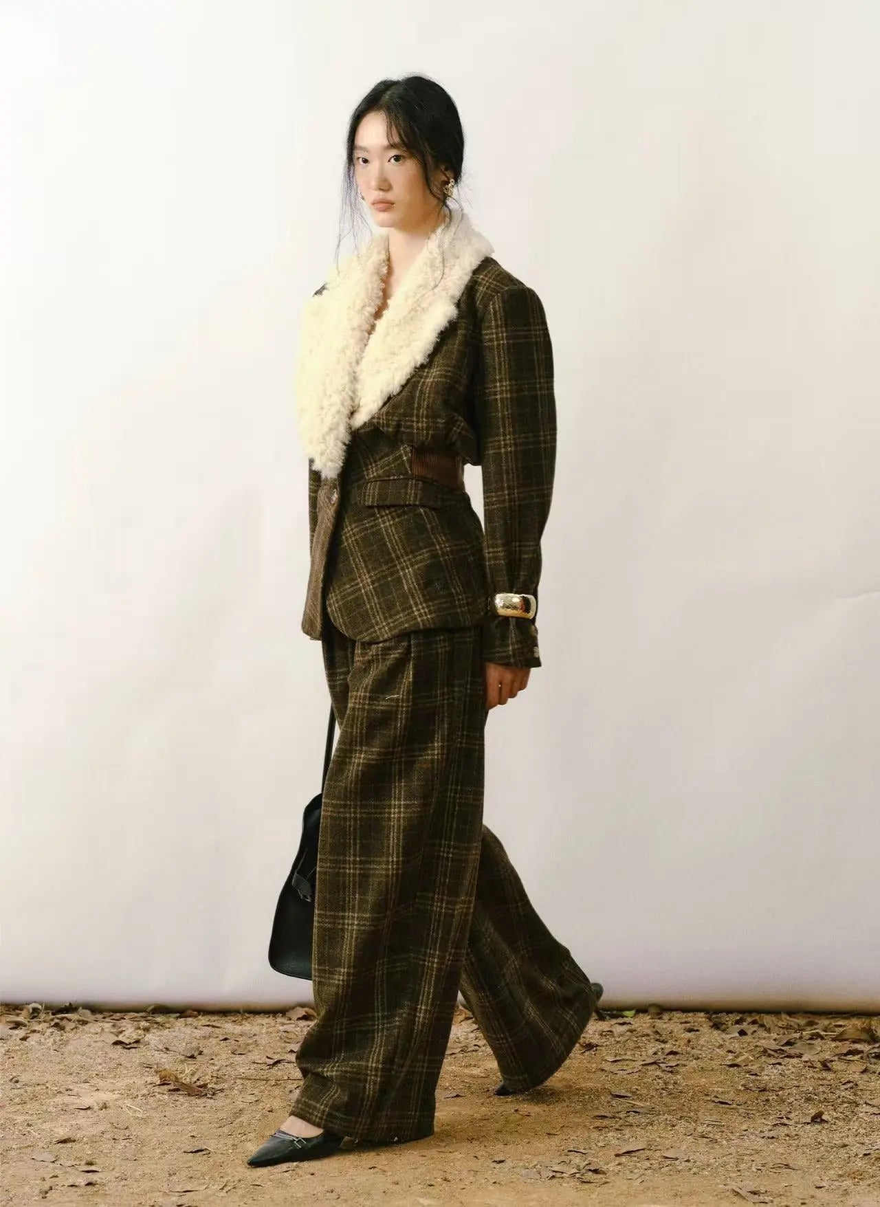 Tailored slim-fit wool blazer in heather grey with notched lapels and two-button closure. - Velanocta