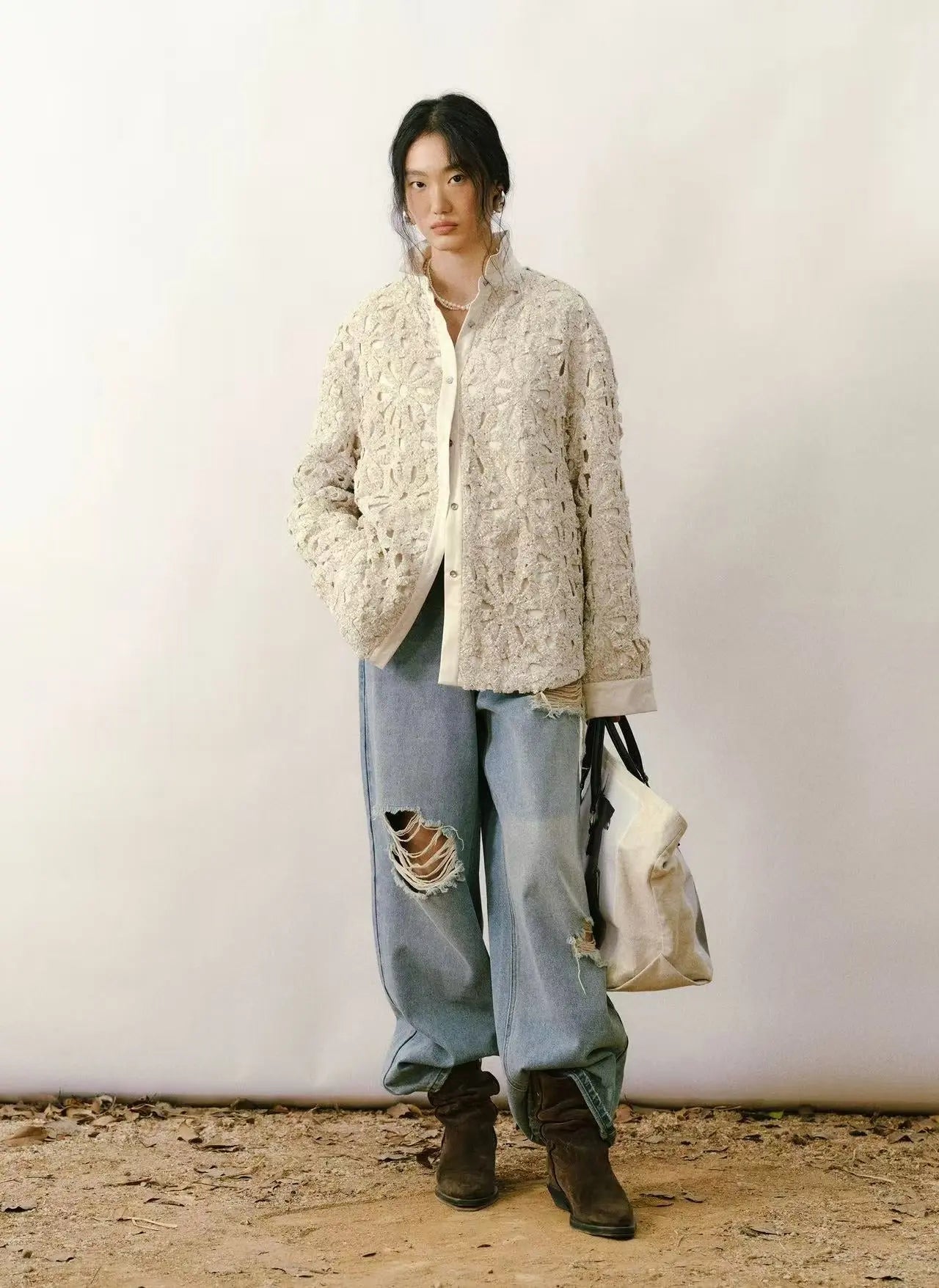 Flat lay of a colorful 90s vintage shirt with a geometric abstract pattern and button-down collar - Velanocta